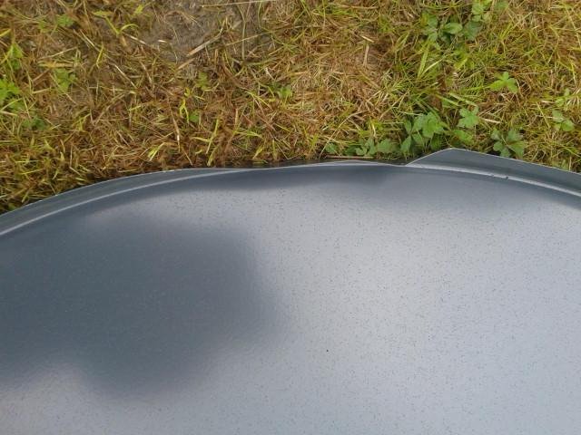 bent dish still installed by an installer